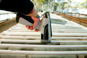 An Atlas Labs technician using an XRF analyzer to test for lead